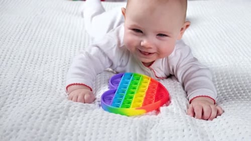 Happy Kid Playing with Pop It