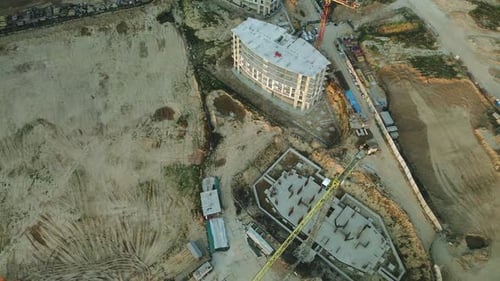 Construction site of a modern city block. High-rise buildings under construction.