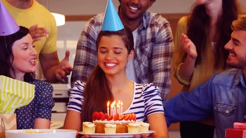 Smiling Friends Celebrating Birthday with Cake at Office