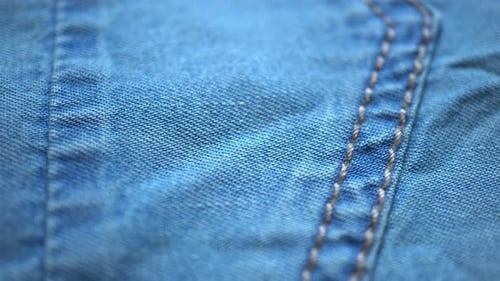 Detailed Macro Shot of Light Blue Denim Fabric