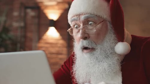 Shocked Santa Looking at Computer