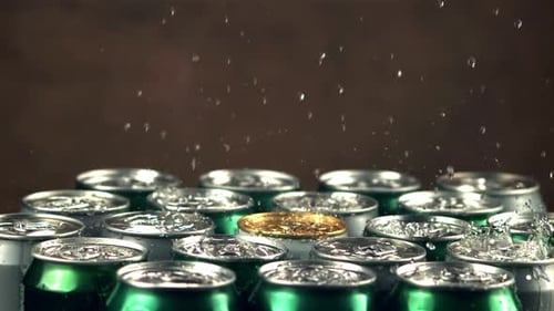 Super Slow Motion Water Droplets Fall on Tins with Beer