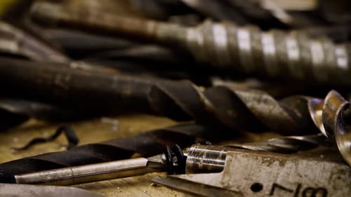 Camera Dollies Across Old and Grimy Tools