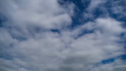 Fluffy Clouds Drifting in a Blue Sky