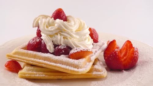 Delicious Waffles with Strawberries and Whipped Cream
