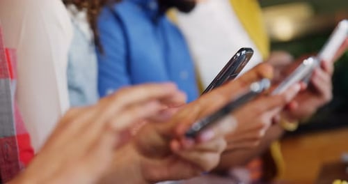 Young Adults Using Phones in Urban Setting