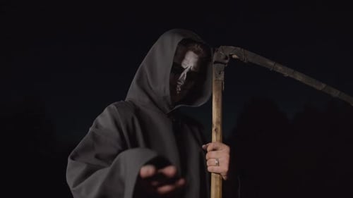 Grim Reaper Menacingly Wielding Scythe at Night