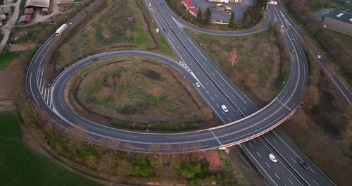 Aerial View of Highway Road Intersection with Fast Moving Heavy Traffic