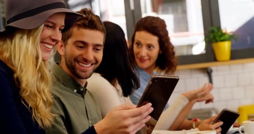 Executives using digital tablet at table 4k