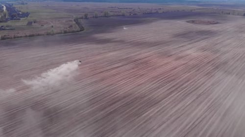 Farming tractor working on field. Agriculture concept