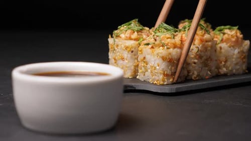 Dunk One Sushi Roll in Soy Sauce on Black Background