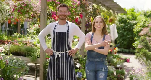 Smiling Man and Woman in Plant Nursery