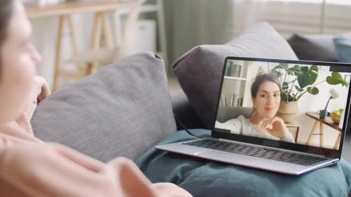Woman Video Chatting with Friend at Home