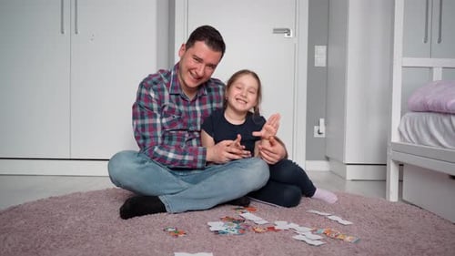 Cheerful Father and Daughter Playing Together Indoors