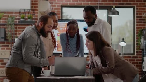 Business Team Analyzing Data in Modern Office