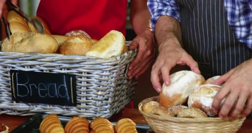 Staff working at bakery counter