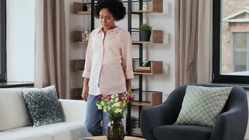 Woman Relaxing on Couch Using Smartphone