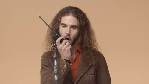 Young Adult Talking into Walkie Talkie