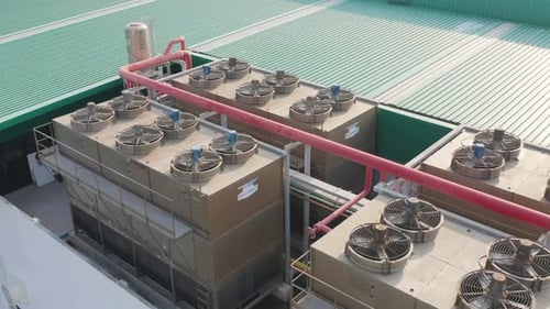 Aerial top view of industry factory ventilation fan cooling motorized stainless steel power units