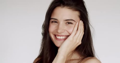 Smiling Woman Portrait with Hand on Face