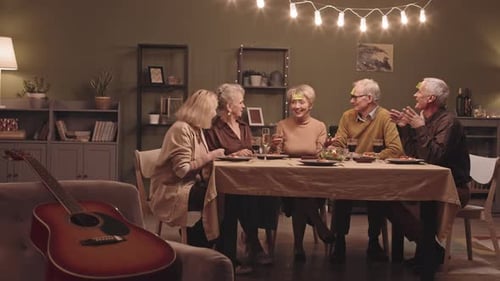 Seniors Laughing and Playing Games at Birthday Party