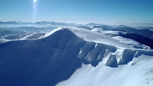 Aerial View of Snow Covered Mountain Range