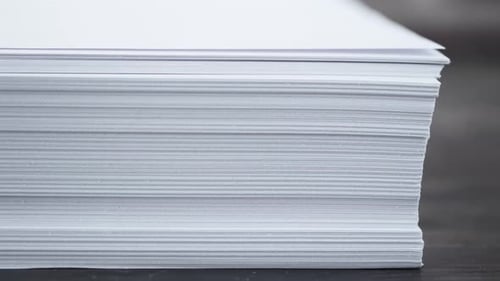 Close Up of Stack of Empty Paper on Table