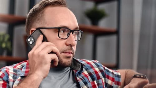 Man Talking on Cell Phone in Home