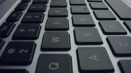 Close Up of Laptop Keyboard Pan