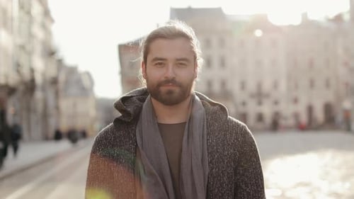 Man With Beard Smiling In City Square