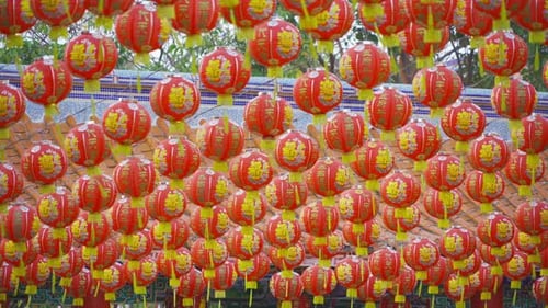 Red chinese lanterns hanging on wire outdoor lamps in temple of China Town decoration
