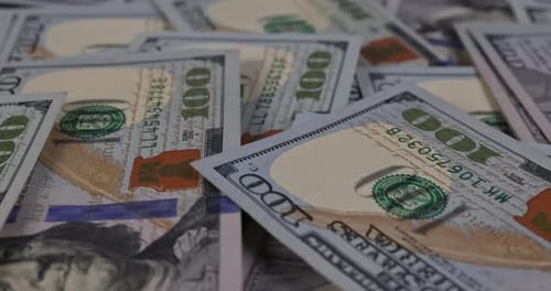 Close Up of Piles of Hundred Dollar Bills