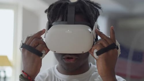 Young Adult Wearing VR Headset Indoors