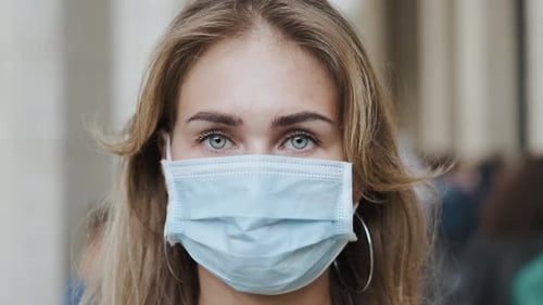 Woman Wearing a Face Mask in the City