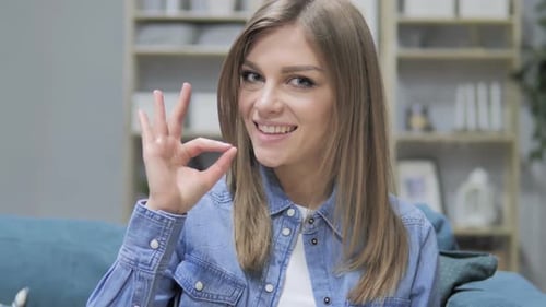 Woman Giving OK Gesture, Smiling