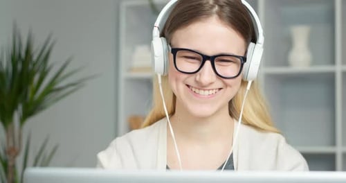 Smiling Woman Waving During Video Call