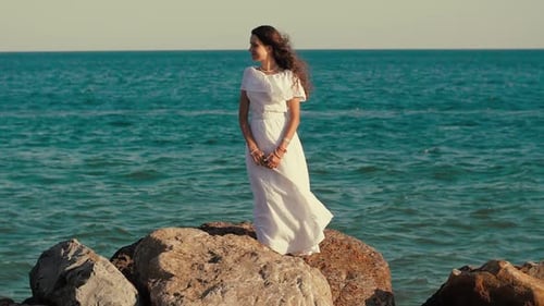 Woman in Dress on the Rock