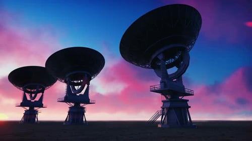 Large Satellite Dishes Rotate Against Vibrant Sunset Sky