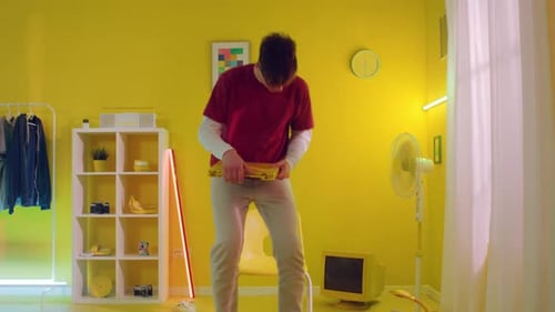 Young Man In Yellow Office