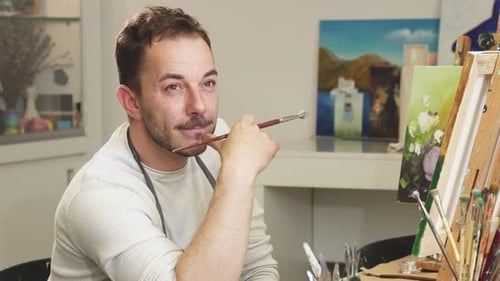 Professional Artist Painter Relaxing at His Studio