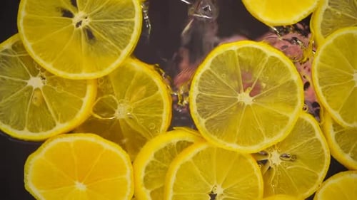 Lemon Slices Floating in Water, Close Up View