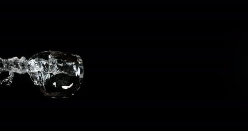 Water Splash Fluid Motion on Black Background