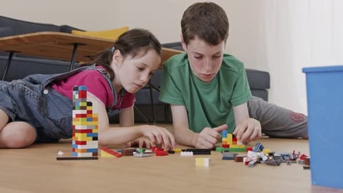Kids Play Together With Colorful Building Blocks