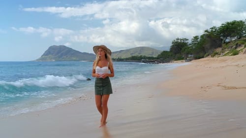 Woman walking on the beach