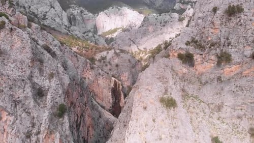 Deep narrow mountain rocky canyon. Flying through rocks. Beauty in nature