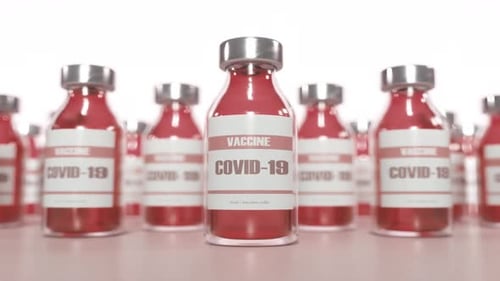 Rows of Vaccine Bottles in Bright Studio Setting