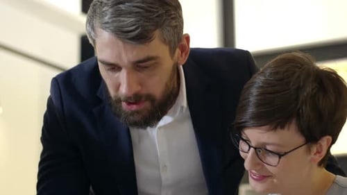 Collaborative Team Discussing Business in Modern Office