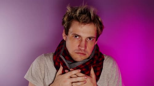 Young Adult Holding Chest Wearing Red Scarf