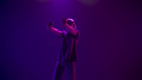 Person Plays Virtual Reality Game with VR Headset