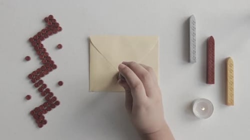 Wax Sealing Letter Using Wooden Classic Seal, Top View